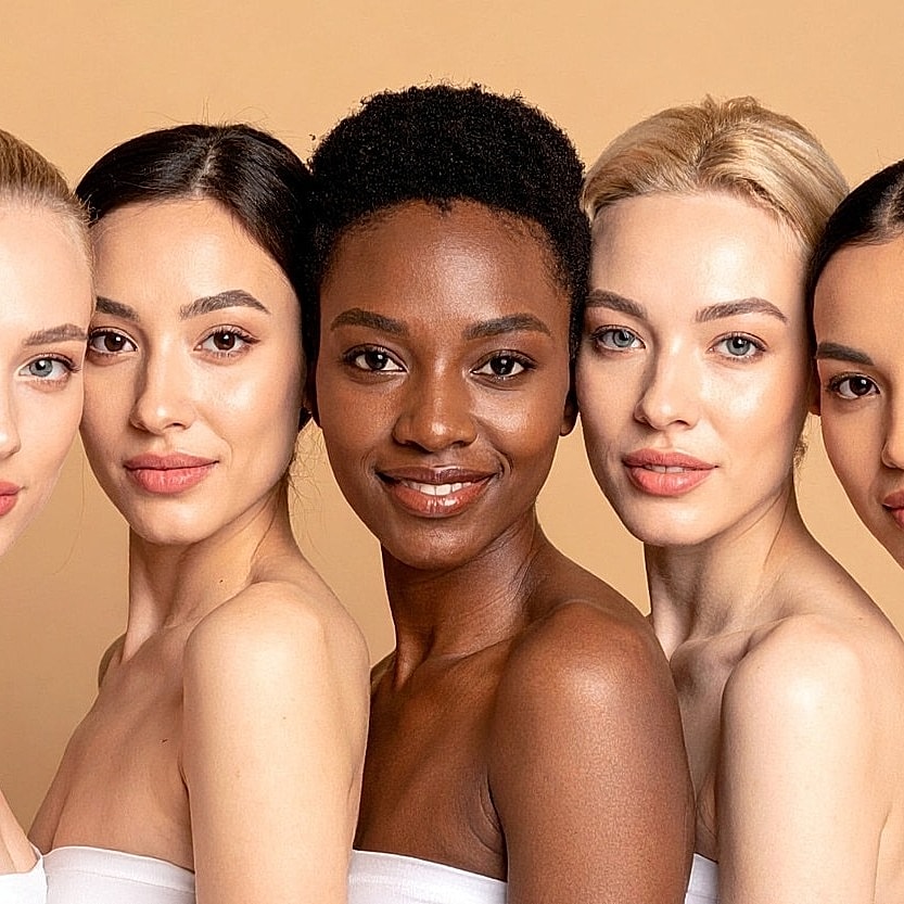 Diverse group of women with radiant smiles.