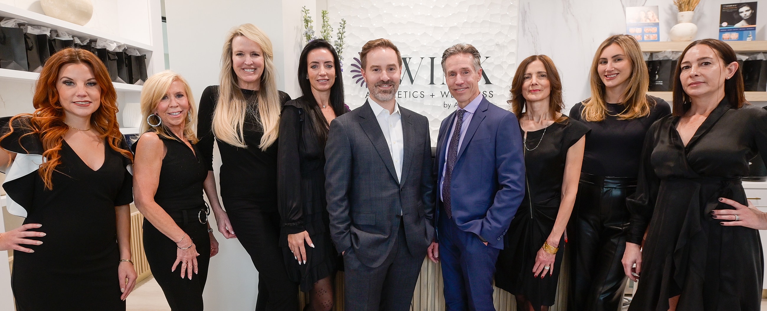 Cityscape reflecting on calm water with buildings.